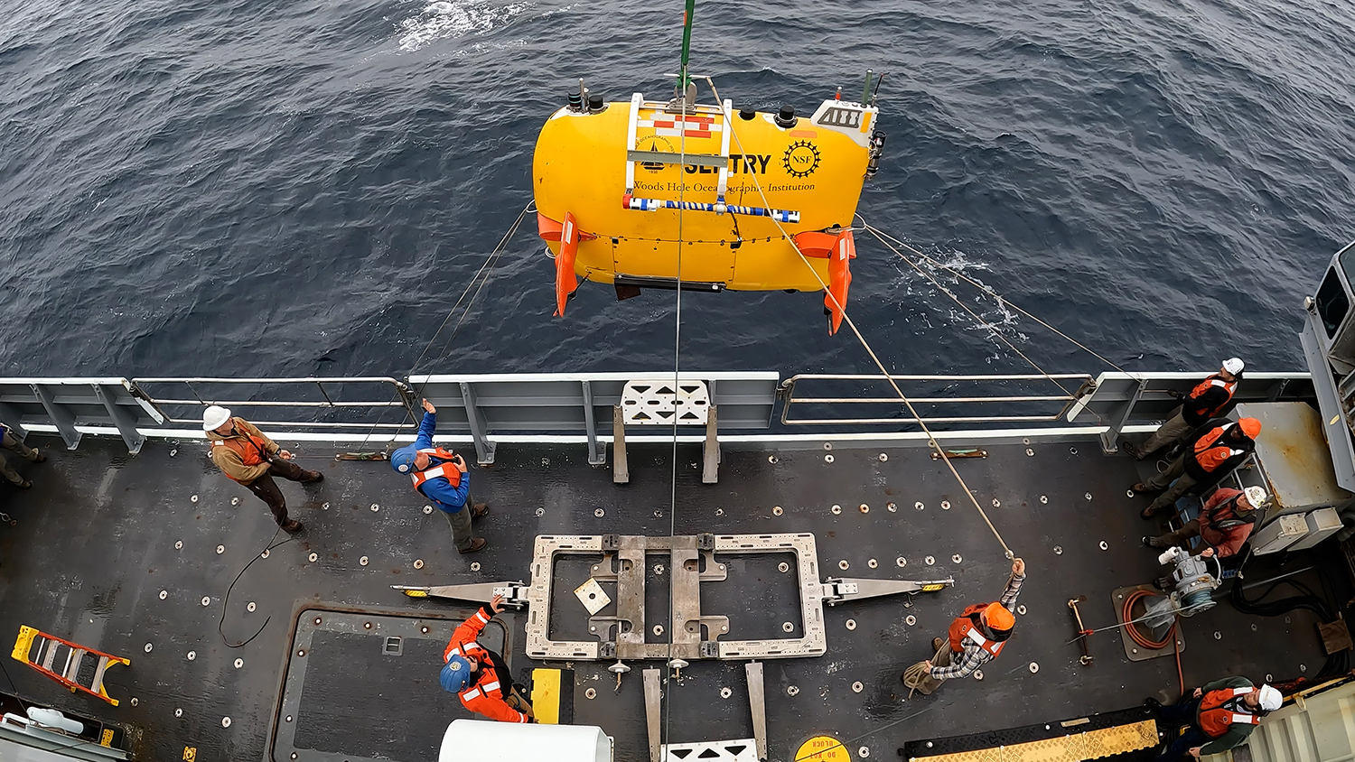 Autonomous underwater vehicle Sentry being deployed from a research vessel