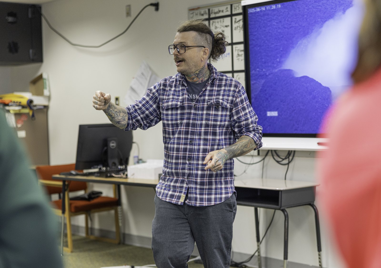 USGS scientist Ashton Flinders talks to students about earthquakes and volcanoes during the Ocean Discovery Day.
