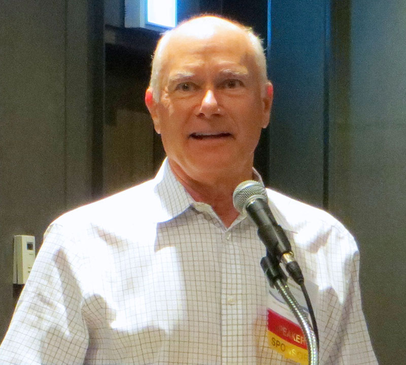 Man speaking into a microphone.
