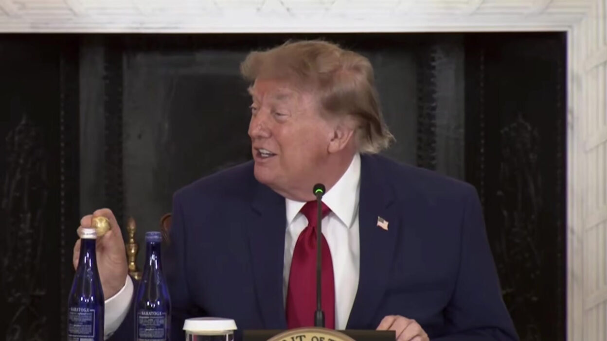 President Trump holds up a solid gold replica of a polymetallic nodule at the American Mining Roundtable